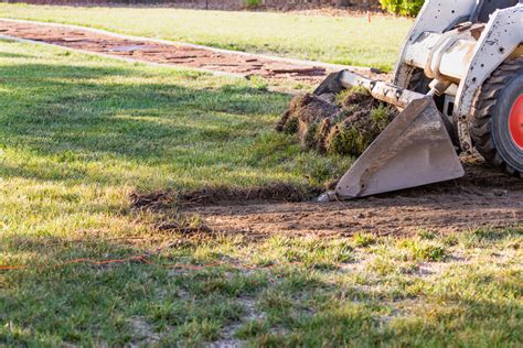 skid steer to level topsoil|skid steer bucket yard grading.